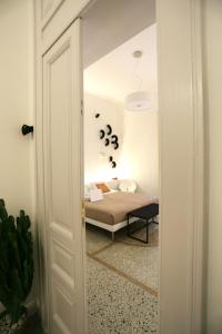 Postel nebo postele na pokoji v ubytování Re Ruggero Rooms
