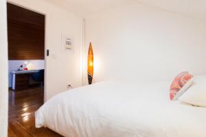 Bairrus Lisbon Apartments - Alfama III tesisinde bir odada yatak veya yataklar