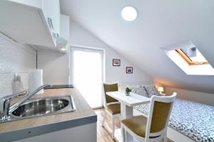 Køkken eller tekøkken på Piccolo Apartments