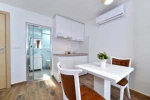 Køkken eller tekøkken på Piccolo Apartments