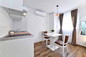 Køkken eller tekøkken på Piccolo Apartments