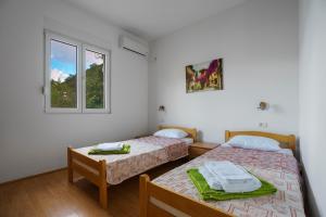 Un pat sau paturi într-o cameră la Villa KOSTA