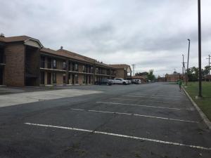 an empty parking lot in front of a building at Days Inn by Wyndham King-Winston Salem Area in King