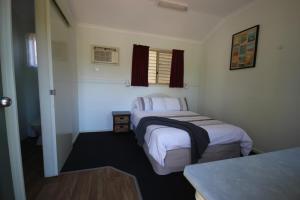 Krevet ili kreveti u jedinici u objektu Silver Wattle Cabins