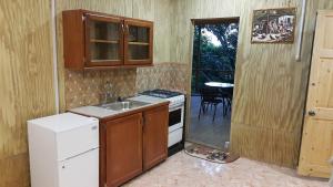 Kuchyň nebo kuchyňský kout v ubytování Cottage Mango