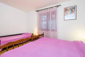 Postel nebo postele na pokoji v ubytování Apartments Nikola