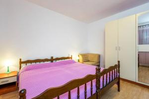 Postel nebo postele na pokoji v ubytování Apartments Nikola