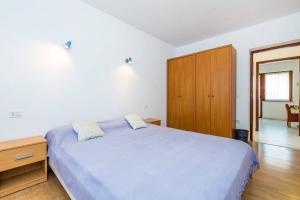 Postel nebo postele na pokoji v ubytování Apartments Nikola