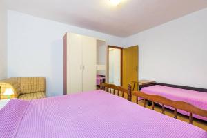 Postel nebo postele na pokoji v ubytování Apartments Nikola
