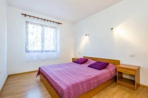 Postel nebo postele na pokoji v ubytování Apartments Nikola