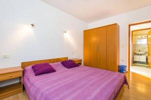Postel nebo postele na pokoji v ubytování Apartments Nikola