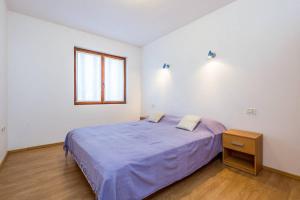 Postel nebo postele na pokoji v ubytování Apartments Nikola