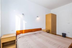 Postel nebo postele na pokoji v ubytování Apartments Nikola