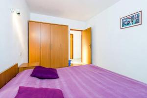 Postel nebo postele na pokoji v ubytování Apartments Nikola