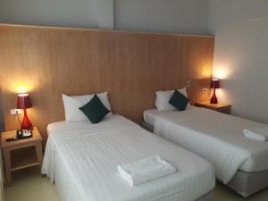 Postel nebo postele na pokoji v ubytování S2S Queen Trang Hotel