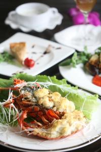 a plate of food with a lobster on a table at Kerama Terrace in Tokashiki