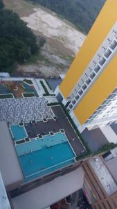 an overhead view of a building with a swimming pool at HNM Homestay Mesahill Nilai KLIA in Nilai