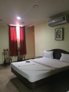 Ένα ή περισσότερα κρεβάτια σε δωμάτιο στο Kingston Palace +8 φωτογραφίες