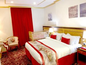 Letto o letti in una camera di Amjad Al Deafah Hotel