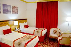 Letto o letti in una camera di Amjad Al Deafah Hotel