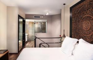 Hotel Gran Derby Suites, a Small Luxury Hotel of the World客房内的一张或多张床位