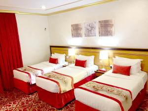 Letto o letti in una camera di Amjad Al Deafah Hotel