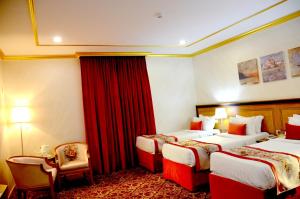 Letto o letti in una camera di Amjad Al Deafah Hotel