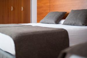 Postel nebo postele na pokoji v ubytování Hotel Via Augusta