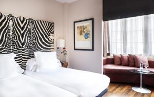 Hotel Gran Derby Suites, a Small Luxury Hotel of the World客房内的一张或多张床位