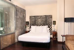 Hotel Gran Derby Suites, a Small Luxury Hotel of the World客房内的一张或多张床位