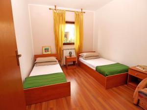 Postel nebo postele na pokoji v ubytování Apartments Dusanka 799