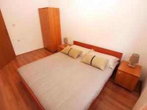 Postel nebo postele na pokoji v ubytování Apartments Dusanka 799