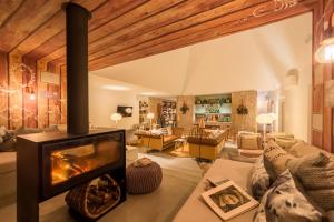 a living room with a fireplace in a house at Luz Charming Houses in Fátima