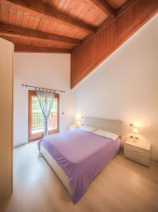 A bed or beds in a room at Residenza Finestra sul Parco