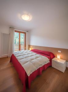 A bed or beds in a room at Residenza Finestra sul Parco