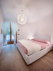 A bed or beds in a room at Residenza Finestra sul Parco