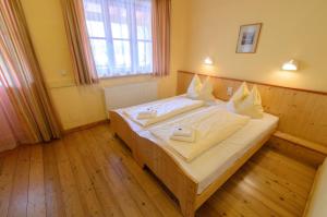Postel nebo postele na pokoji v ubytování JUFA Hotel Donnersbachwald
