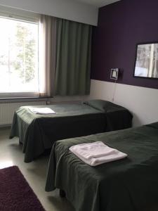 Postel nebo postele na pokoji v ubytování Vuokatti Sport Resort