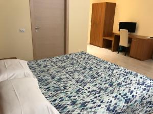 Letto o letti in una camera di Hotel Elys