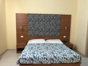 Letto o letti in una camera di Hotel Elys