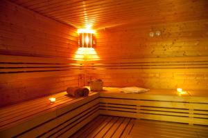 a sauna with two towels and lights in it at Penzion s wellness Uherské Hradiště in Uherské Hradiště