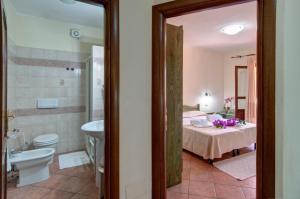 Koupelna v ubytování I Ginepri Hotel