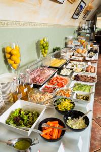a buffet line with many different types of food at Hotel Regent in Krakow
