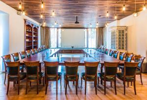 a large conference room with a long table and chairs at Vila Leonida - RESORT LEONIDA in Buşteni