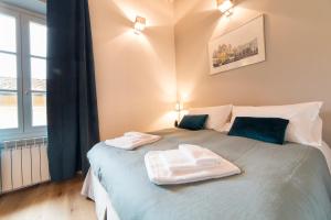 Posteľ alebo postele v izbe v ubytovaní Santa Croce apartment