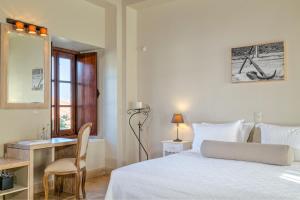 Ein Bett oder Betten in einem Zimmer der Unterkunft Mare Monte Luxury Suites