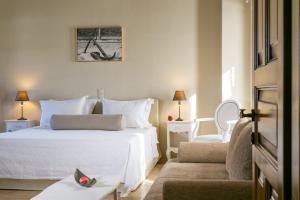 Ein Bett oder Betten in einem Zimmer der Unterkunft Mare Monte Luxury Suites