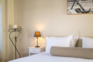 Ein Bett oder Betten in einem Zimmer der Unterkunft Mare Monte Luxury Suites