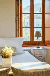 Ein Bett oder Betten in einem Zimmer der Unterkunft Mare Monte Luxury Suites