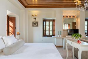 Ein Bett oder Betten in einem Zimmer der Unterkunft Mare Monte Luxury Suites
